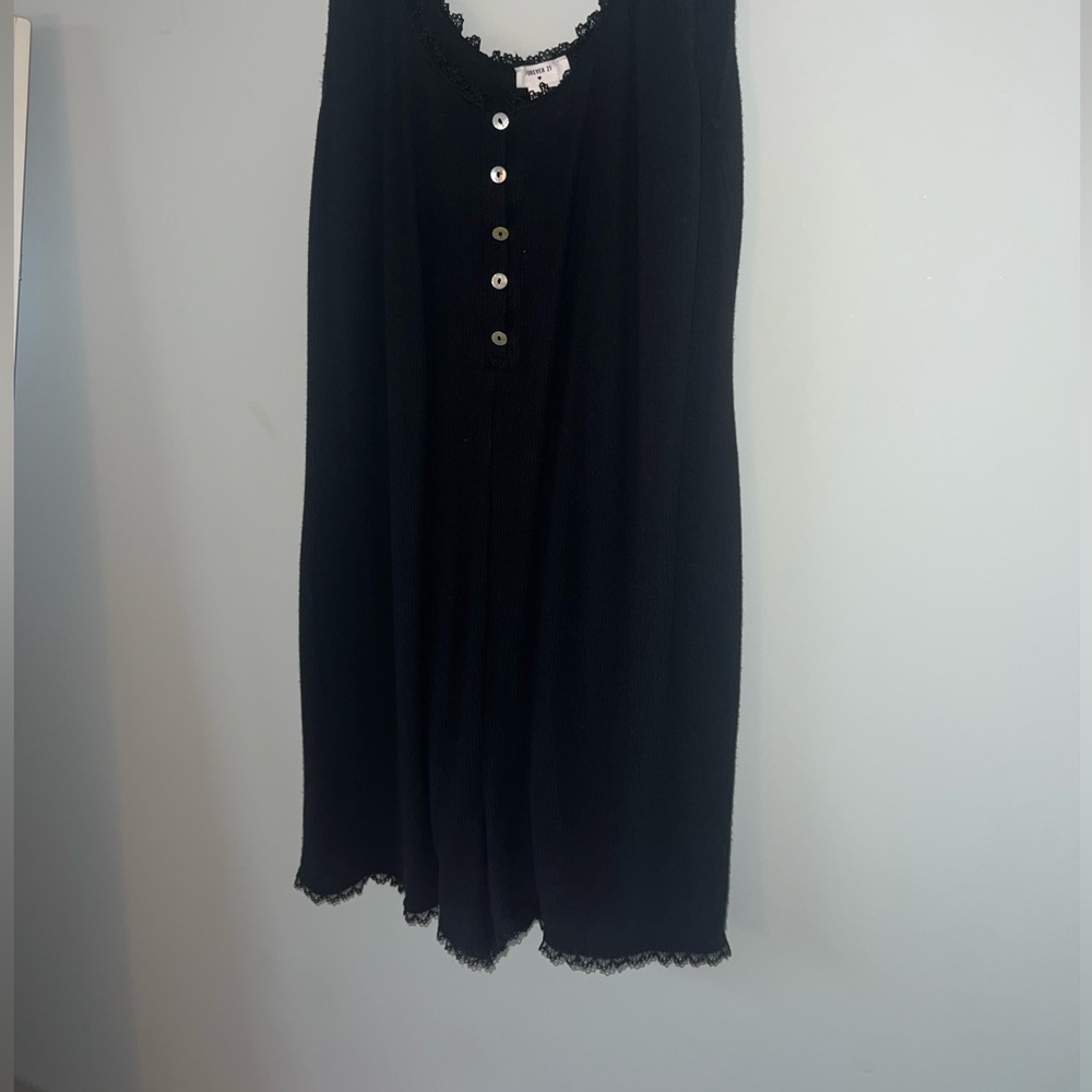 A Forever 21 coquette theme black romper.